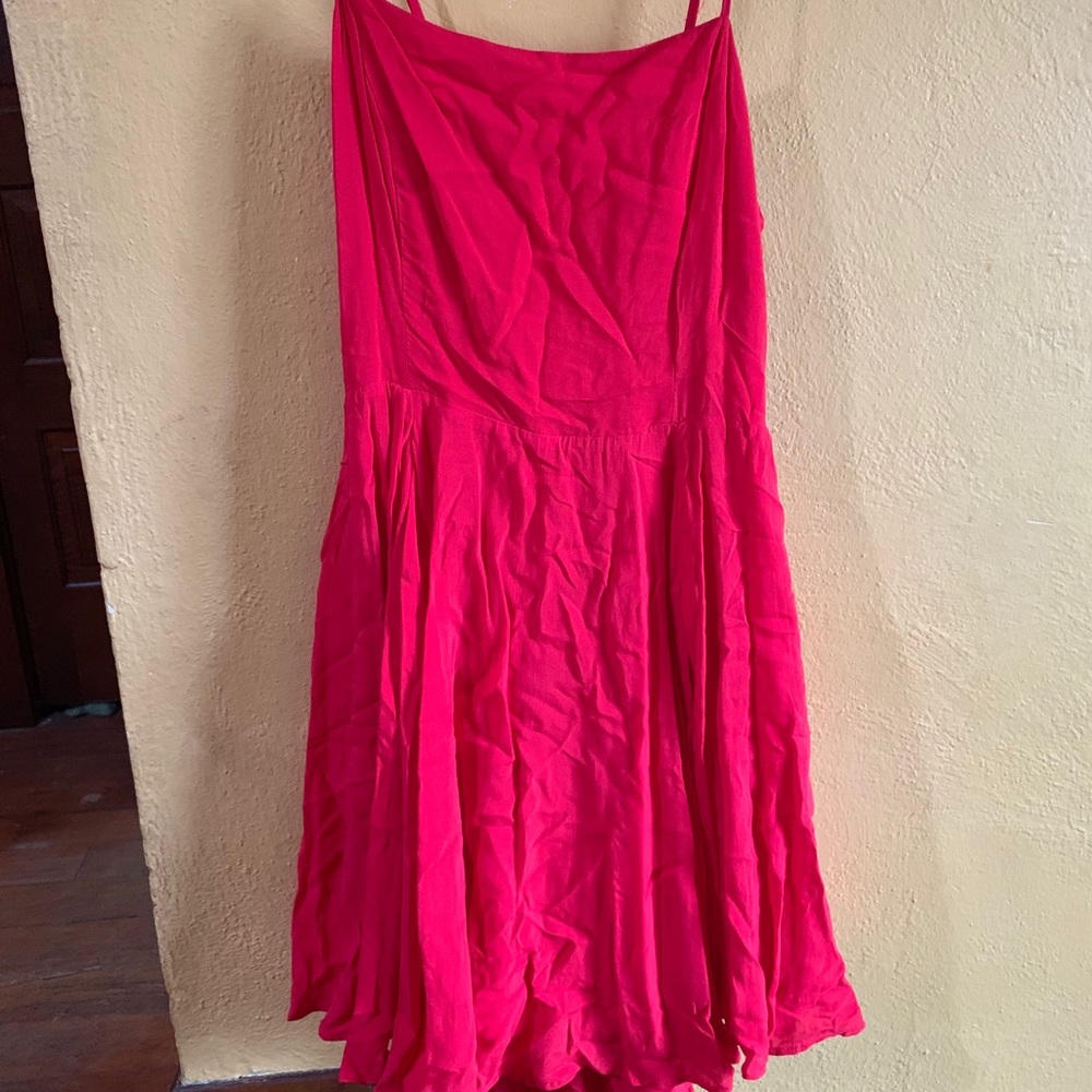 Red fit and flat dress with open back